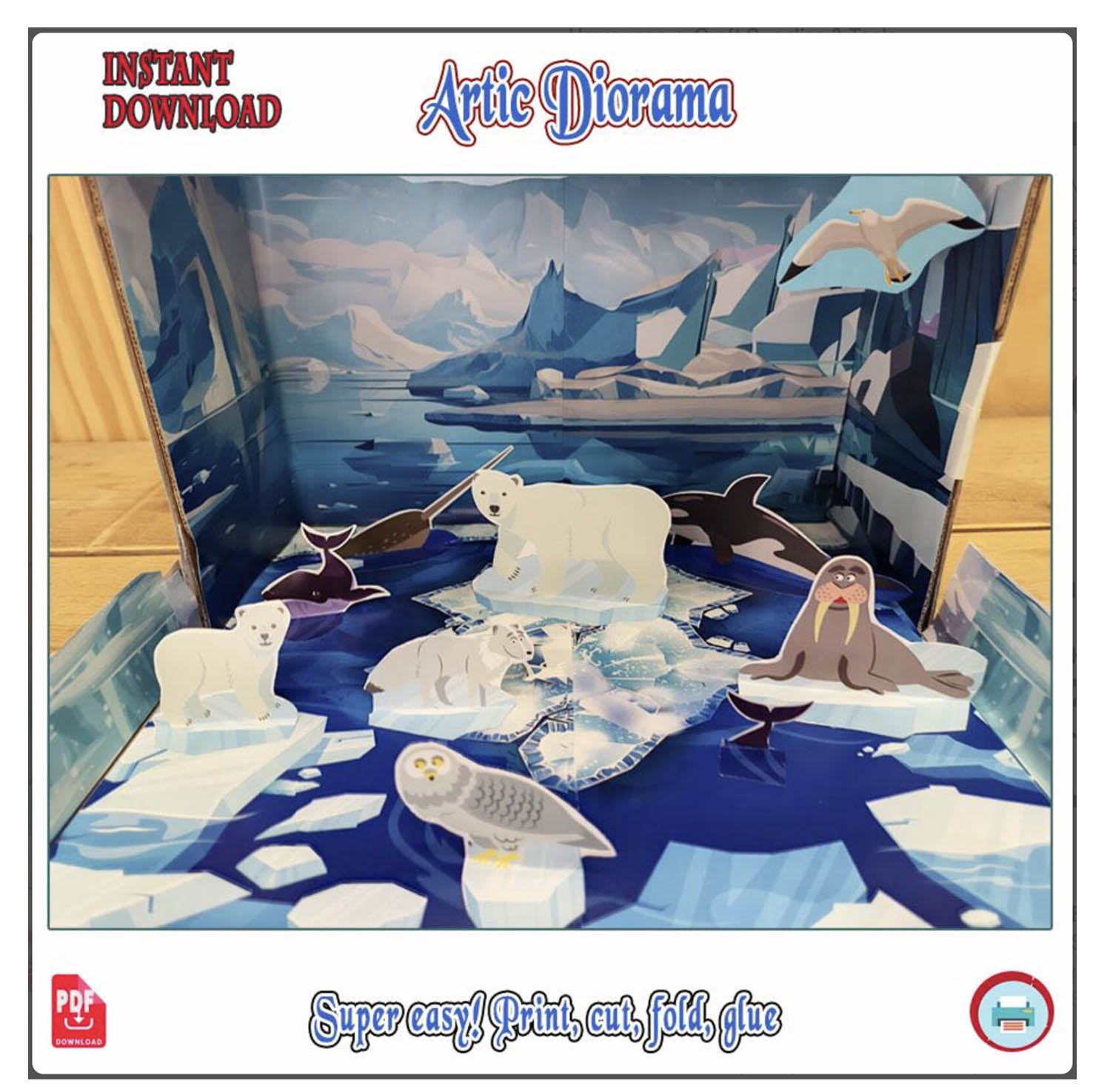 Close-up of the assembled Arctic diorama showing polar bears, a walrus, an orca and a snowy owl among paper ice floes
