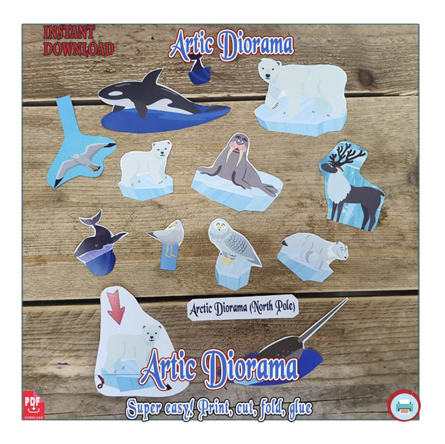 Separate paper animal cutouts including polar bears, a walrus, an orca, a narwhal, a reindeer and a snowy owl