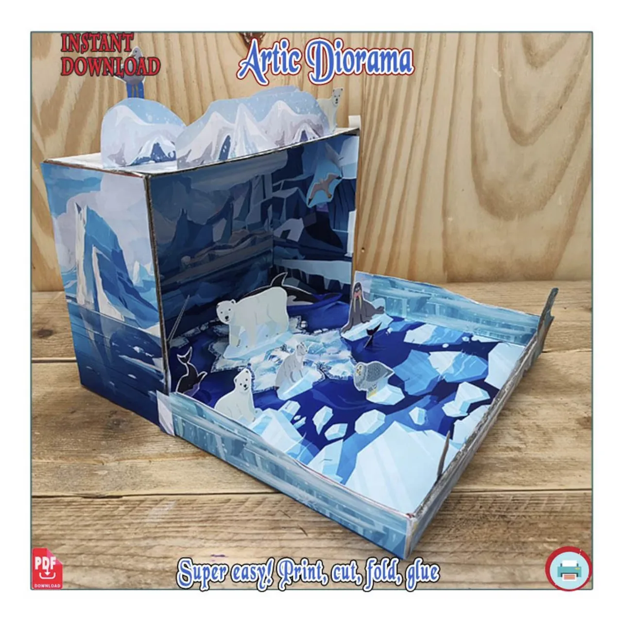 Left-side view of an Arctic shoebox diorama showing the upright box walls, extended base and standing paper animals