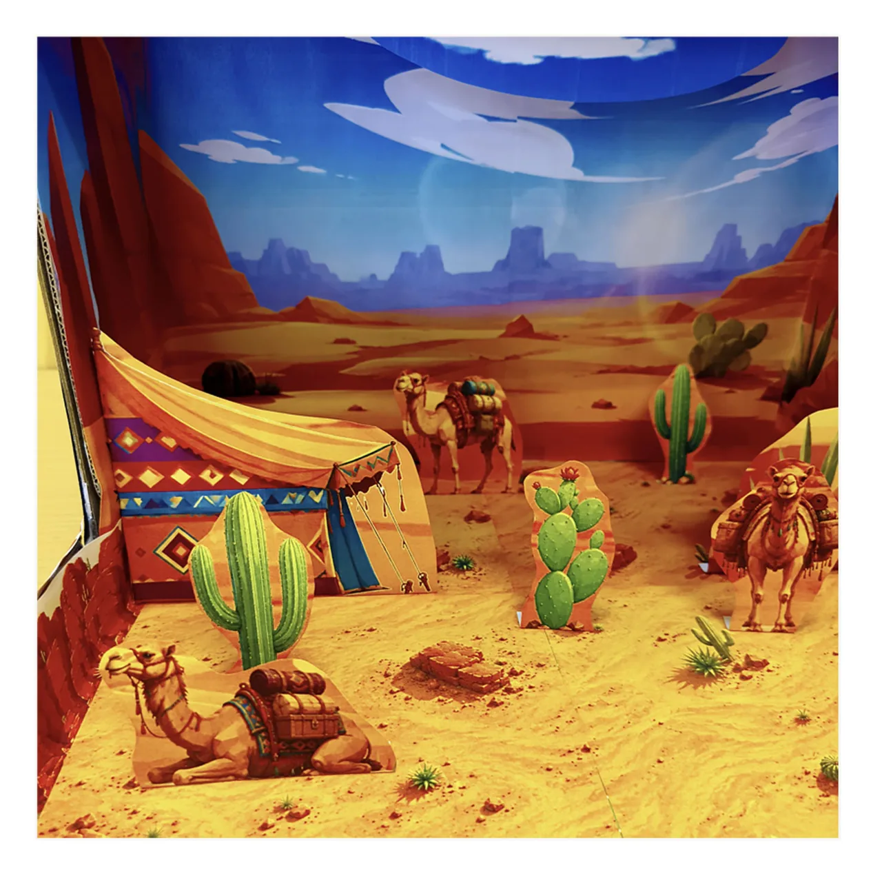 Desert habitat model with camels cactus and desert animals