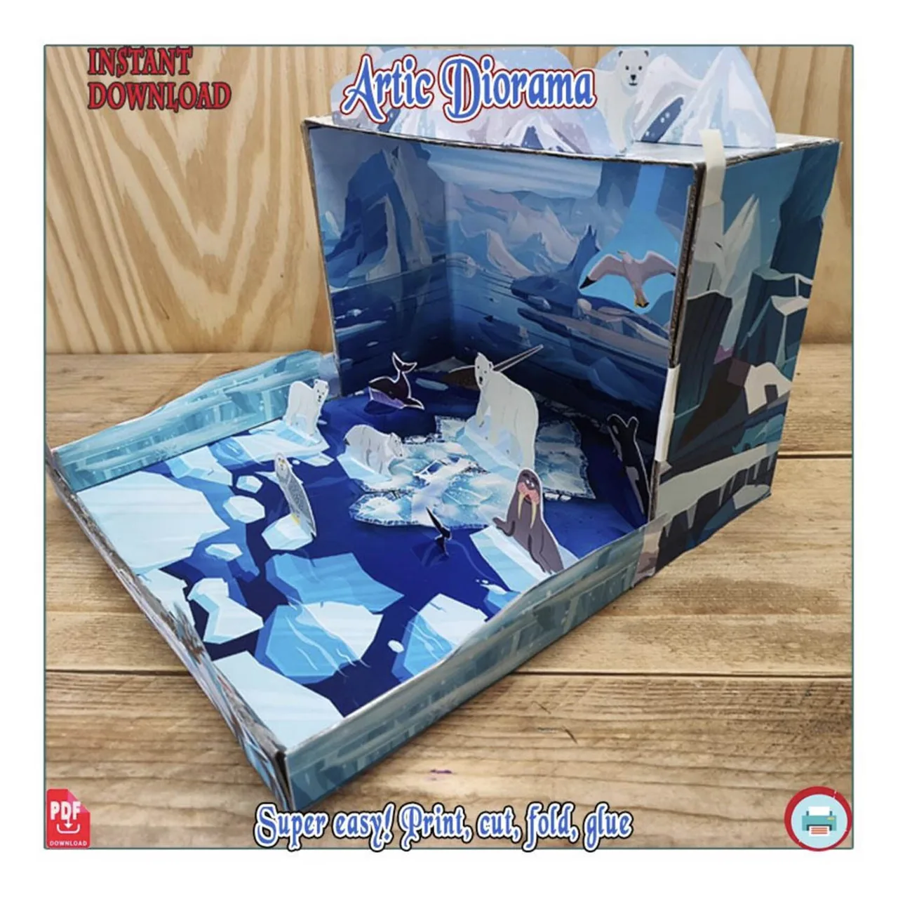 Angled view of a polar bear habitat paper diorama with bears on illustrated ice, a walrus and an ocean backdrop