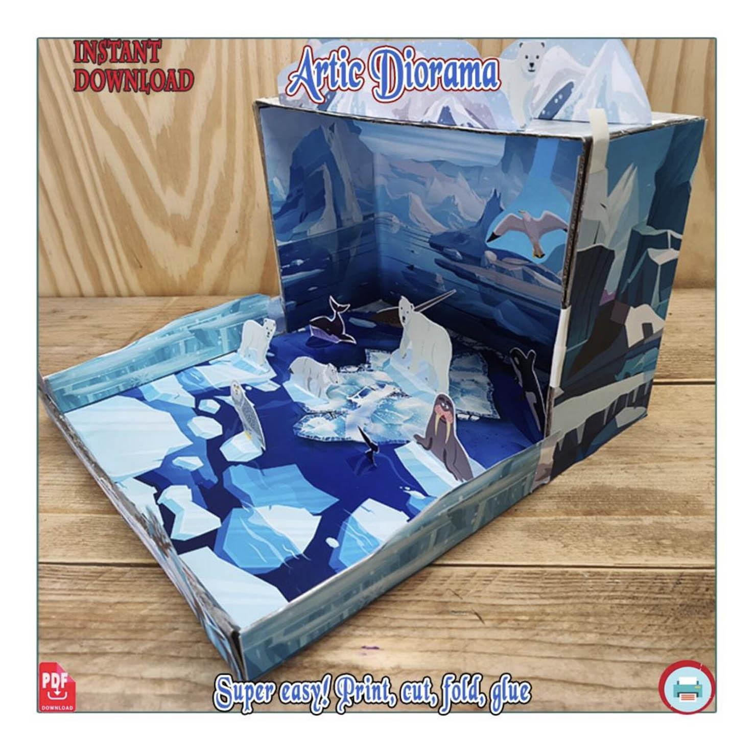 Angled view of a polar bear habitat paper diorama with bears on illustrated ice, a walrus and an ocean backdrop