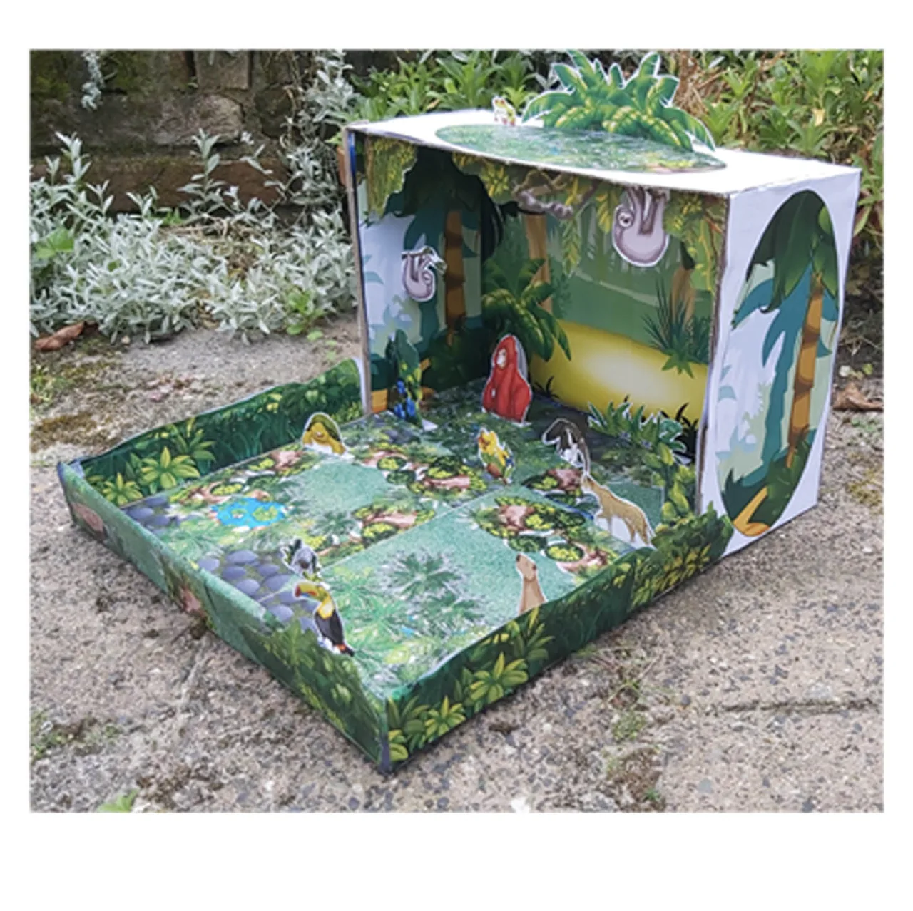 Rainforest habitat model with tropical animals and plants