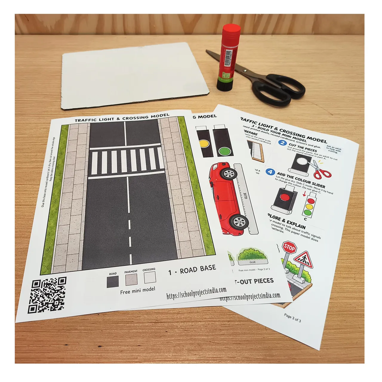 Printed road safety templates with cardboard, scissors and a glue stick.