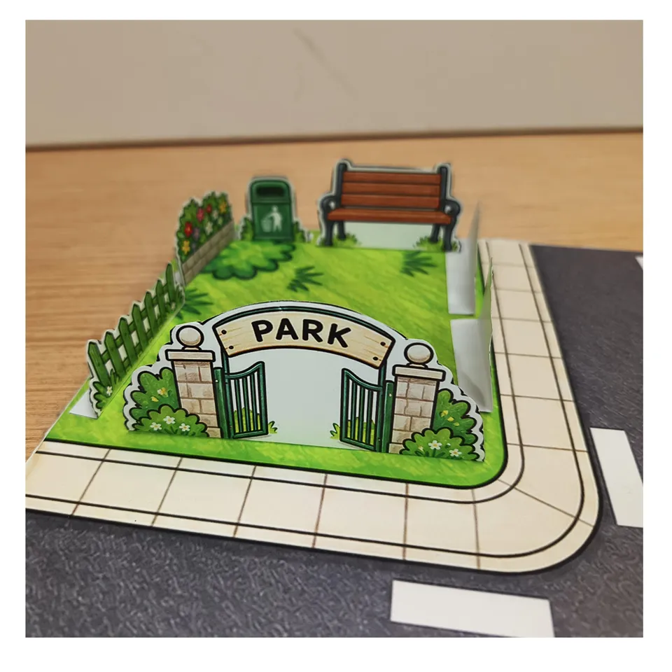 Assembled paper park with entrance gate, bench and fences