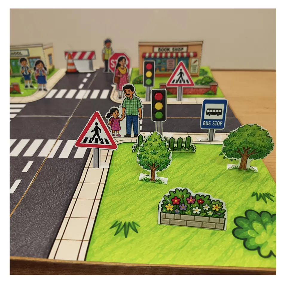 Bus stop signs and paper trees beside the town crossroads