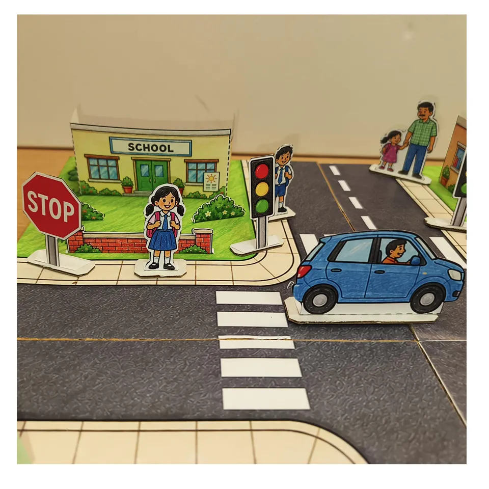 Blue paper car beside the school zebra crossing and pedestrians