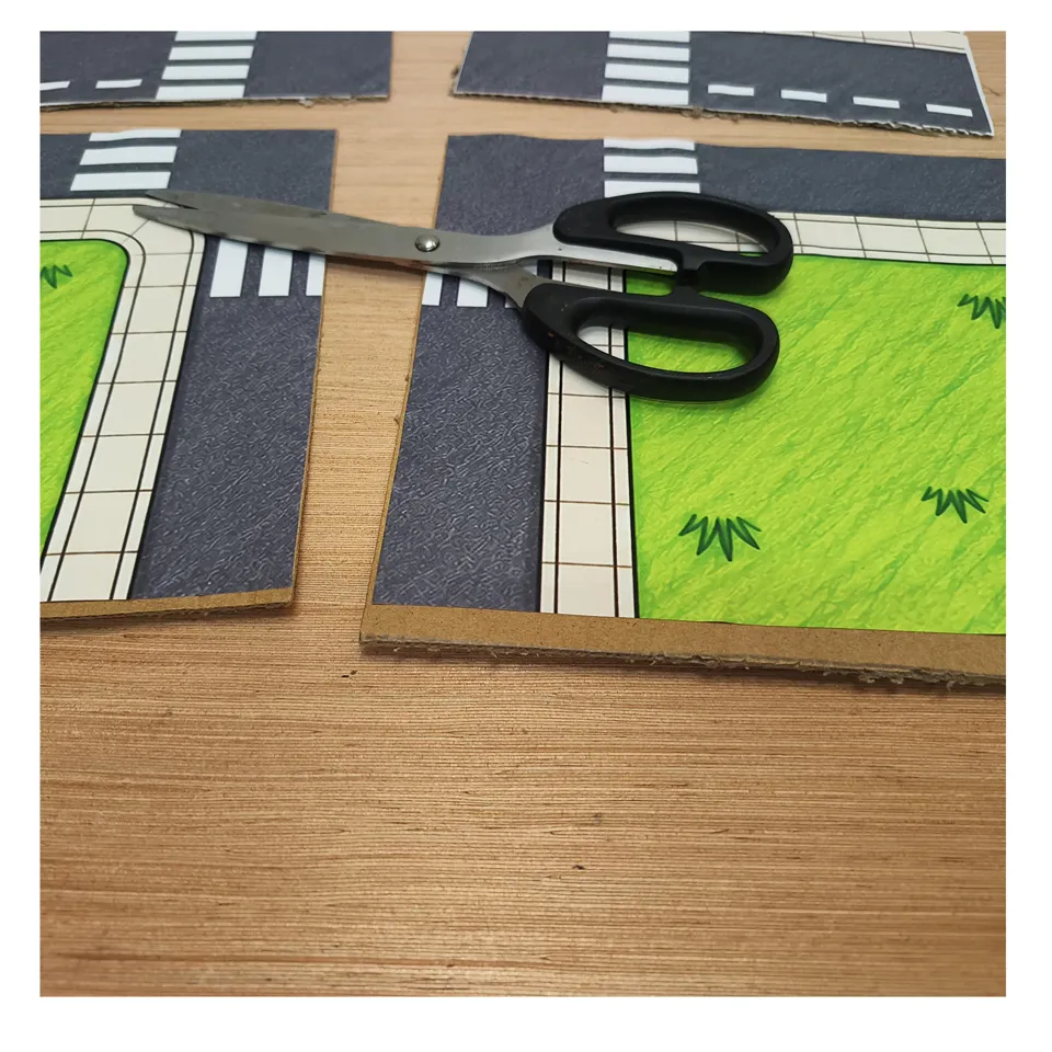 Cutting out the road and zebra crossing sections for the town base
