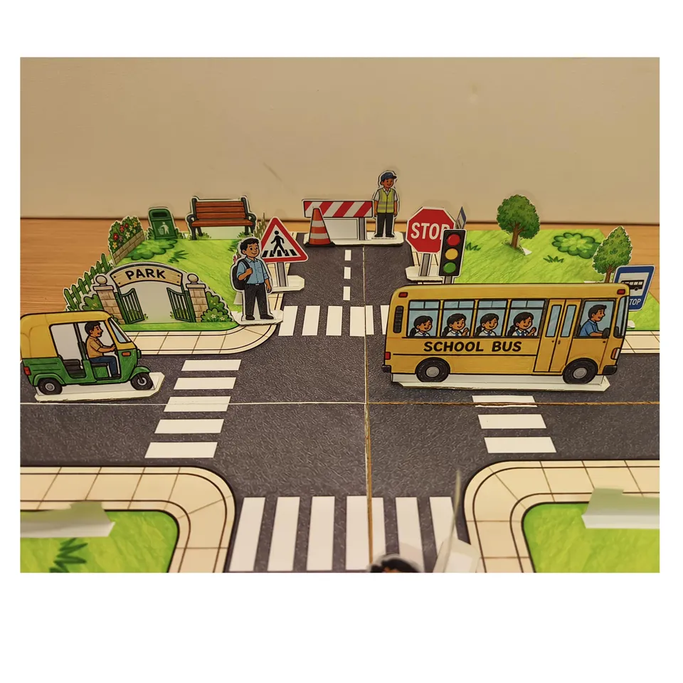 Traffic Town road safety project with a school bus at the crossroads